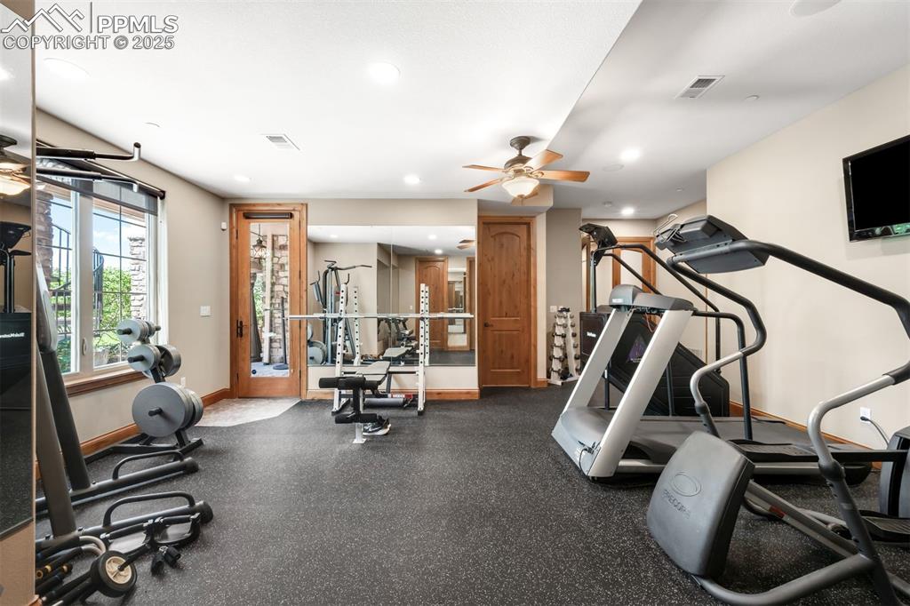 Image 34 of 47: In-home gym with sound-absorbing flooring