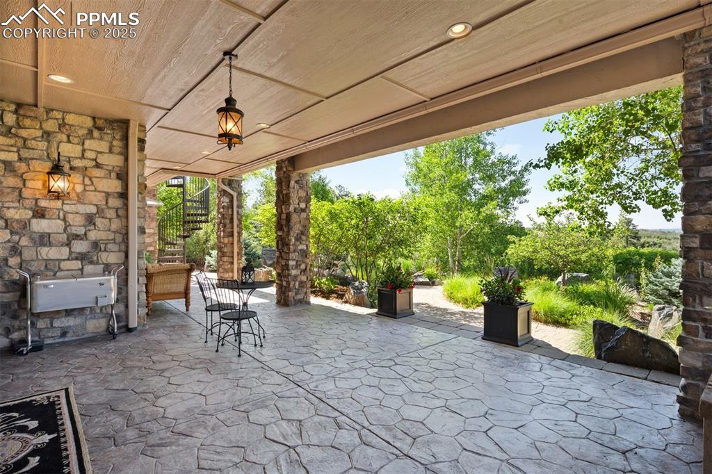 Image 35 of 47: Patios & pathways are stamped & stained concrete, both attractive & durable