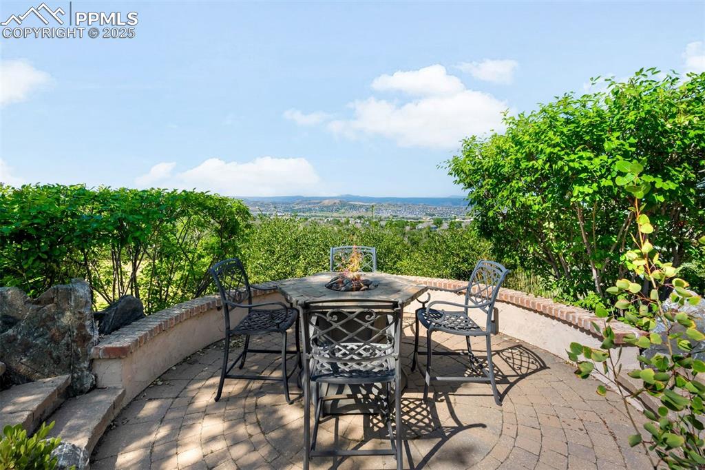 Image 36 of 47: Enjoy northwest facing views from the firepit tucked into a corner of the g