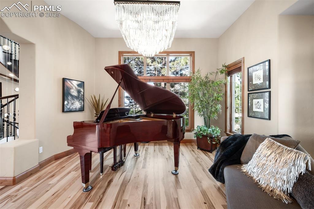 Image 9 of 47: Currently used as a music room, this versatile space at the front of the ho