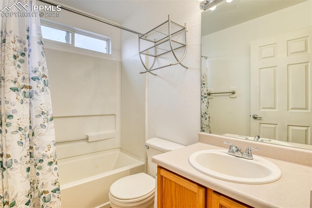Image 17 of 21: Full bath featuring vanity and shower / bathtub combination with curtain