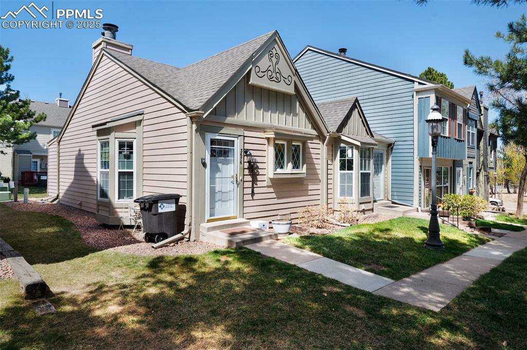 Caption: View of the front and south side of the property