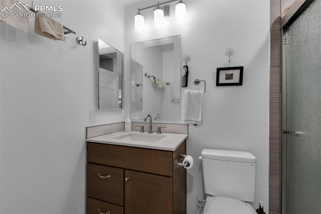 Image 15 of 26: Bathroom with vanity and a walk-in shower