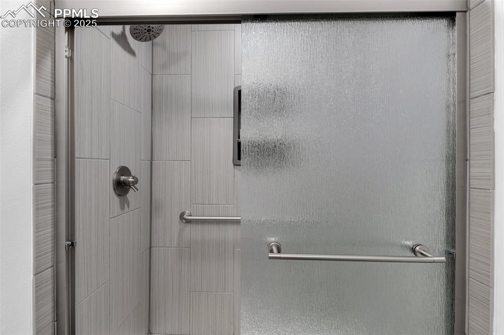 Image 16 of 26: Full bathroom featuring a walk-in shower