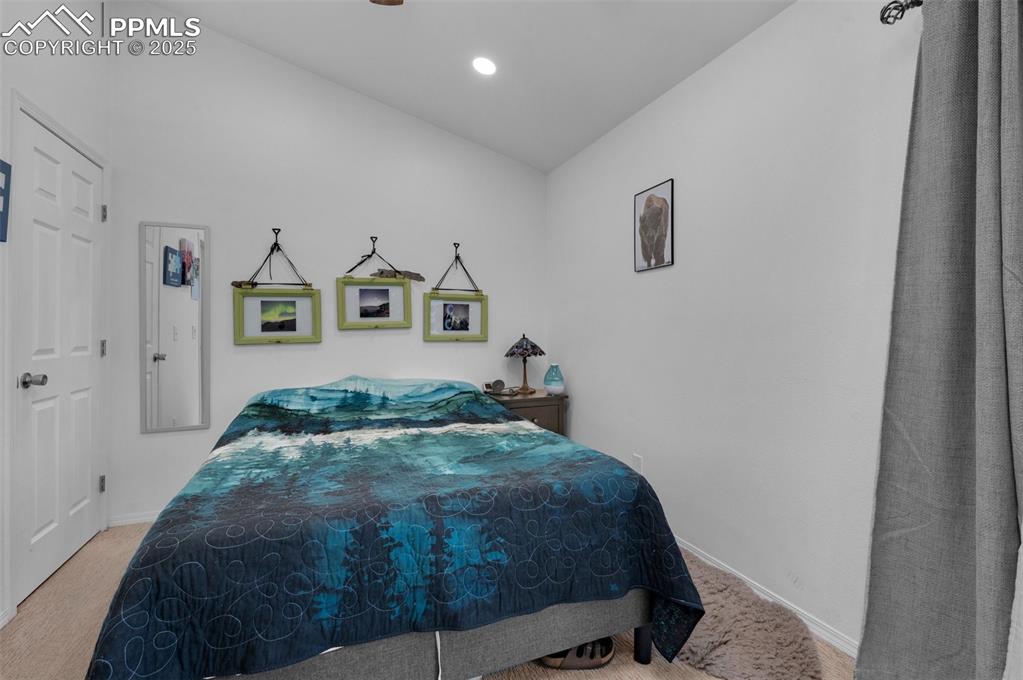 Image 18 of 26: Bedroom with light carpet, recessed lighting, and a ceiling fan
