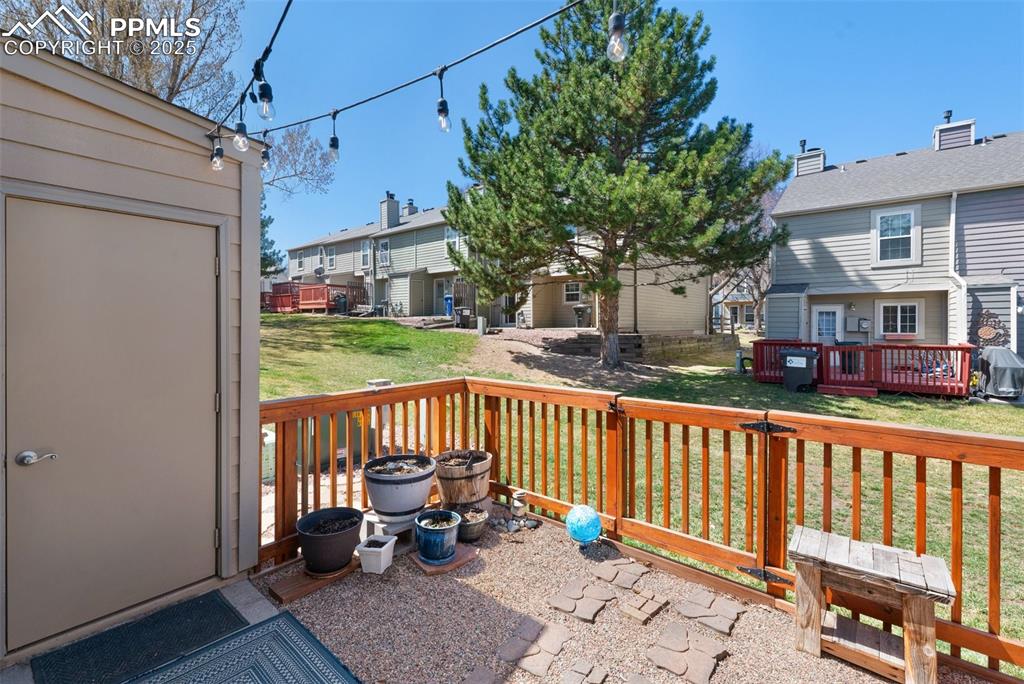 Image 22 of 26: View of patio with a residential view and a deck