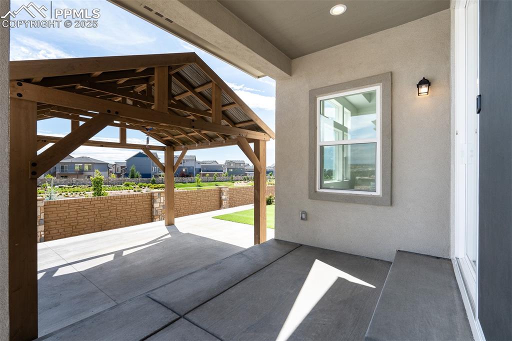 Image 10 of 46: View of patio / terrace with a gazebo and a residential view