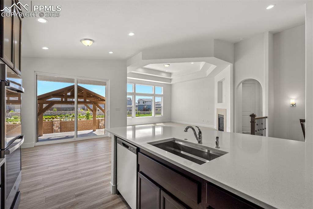 Image 19 of 46: Kitchen featuring open floor plan, recessed lighting, appliances with stain
