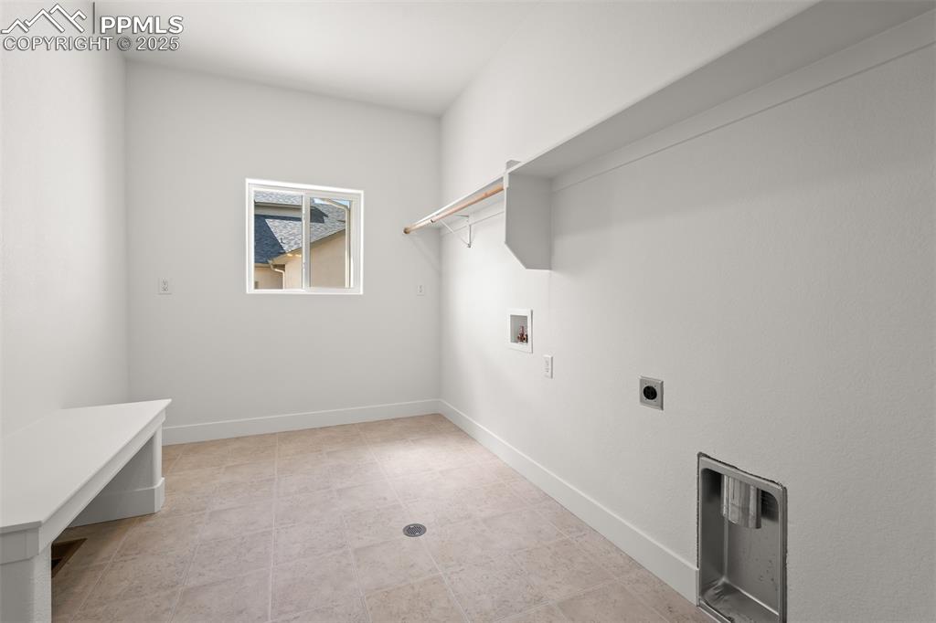 Image 31 of 46: Laundry room with washer hookup and electric dryer hookup