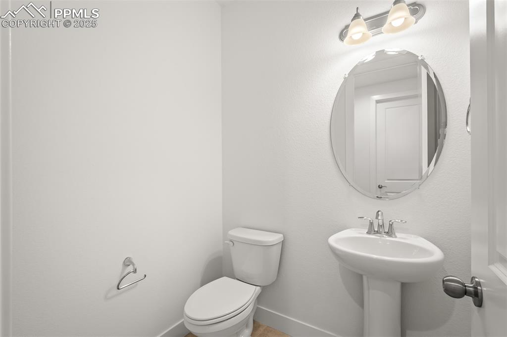 Image 32 of 46: Bathroom with toilet and baseboards