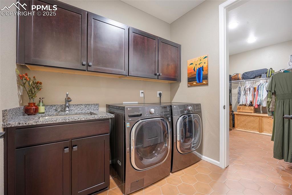 Image 22 of 48: Laundry room attached to primary closet
