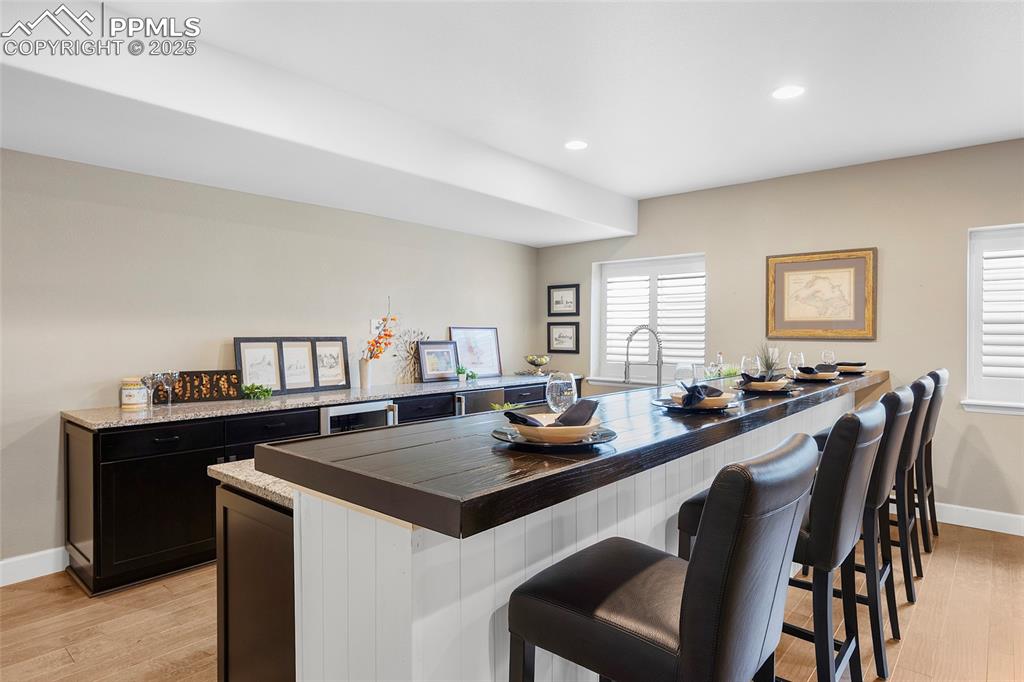 Image 31 of 48: Custom made bar, great for entertaining.