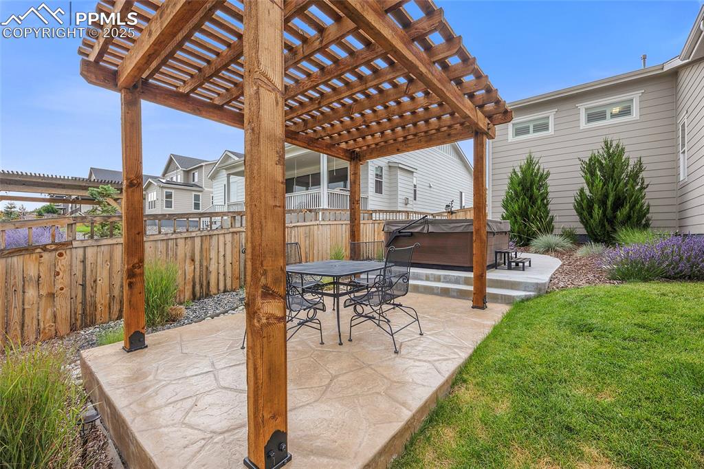 Image 40 of 48: Cedar Fir Pergola with 8 person Bullfrog Hot Tub.