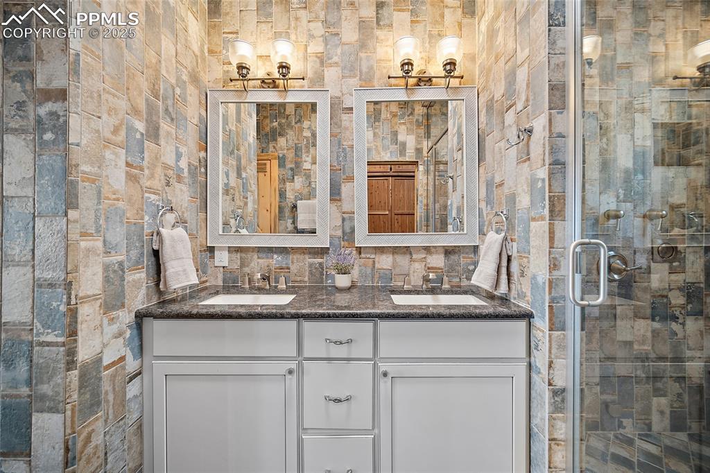 Image 15 of 50: Primary bathroom double vanity with ample storage