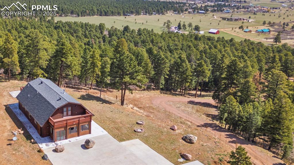 Image 2 of 50: Front aerial view of home and property