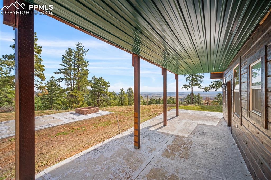 Image 20 of 50: Covered wrap around patio off of master suite