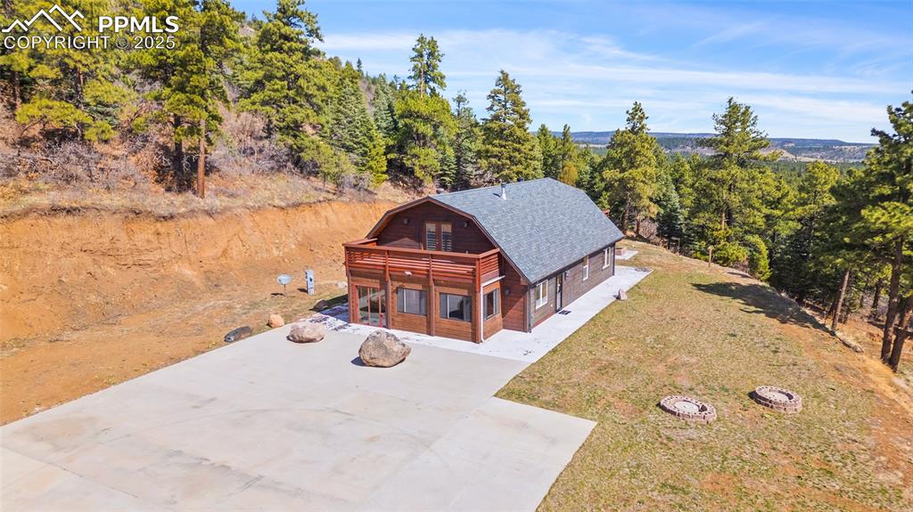 Image 41 of 50: Front aerial view of home and driveway