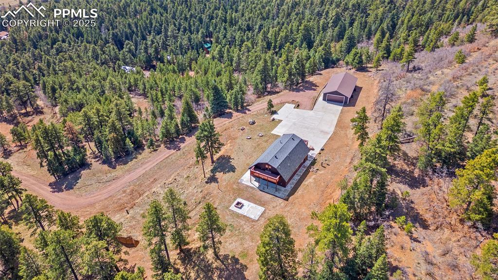 Image 43 of 50: Aerial view of home and property
