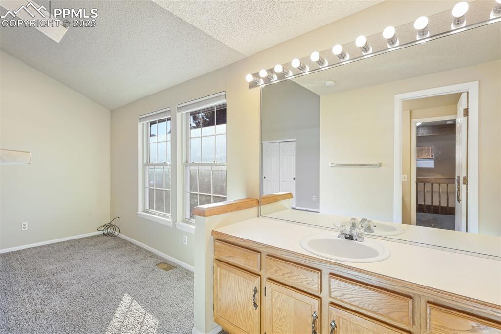 Image 19 of 39: Primary Bedroom with Private Vanity!
