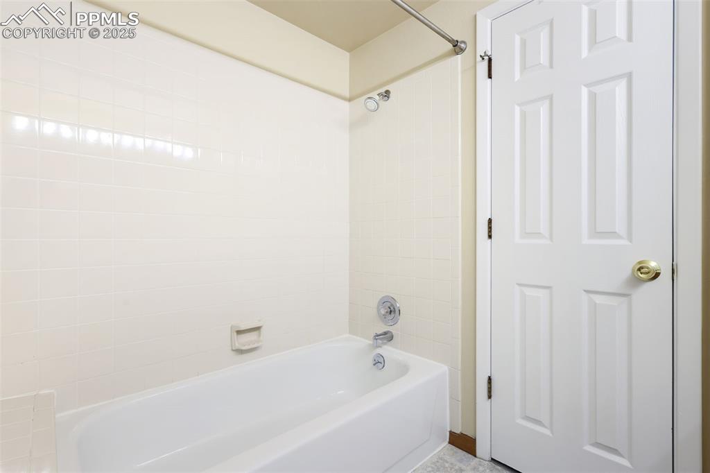 Image 22 of 39: Upstairs Bathroom Adjoins Primary Bedroom and Is Accessible from the Hallwa