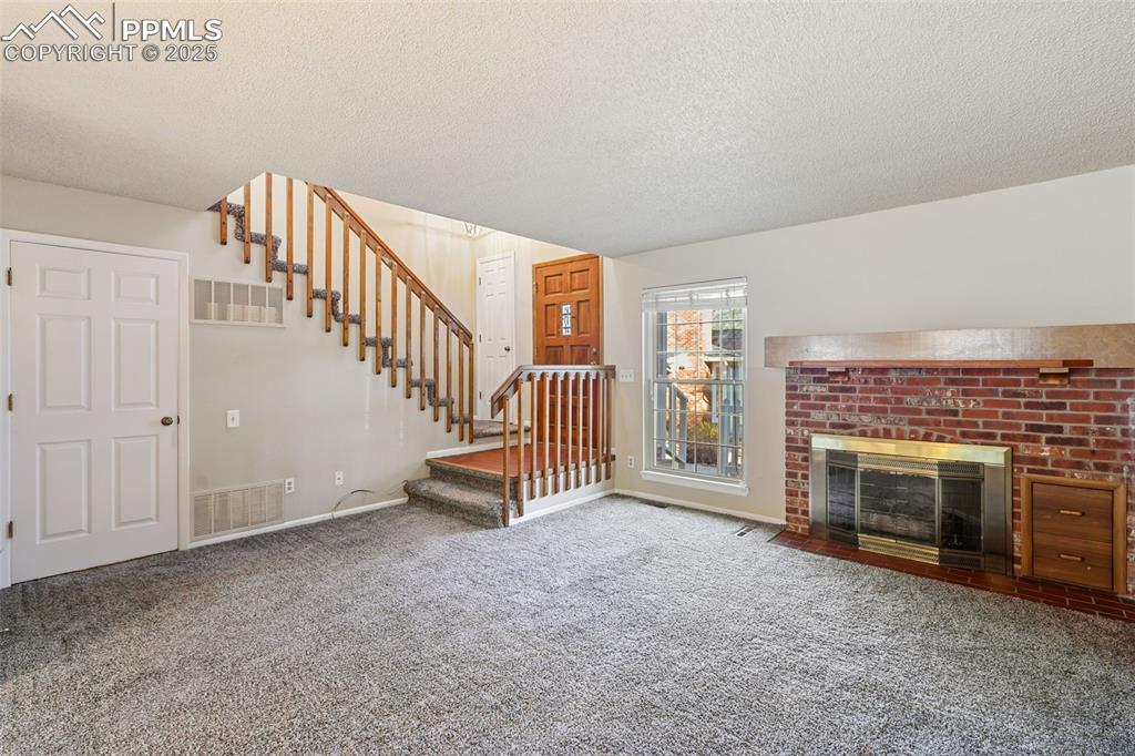 Image 4 of 39: Warm, Inviting Living Room!