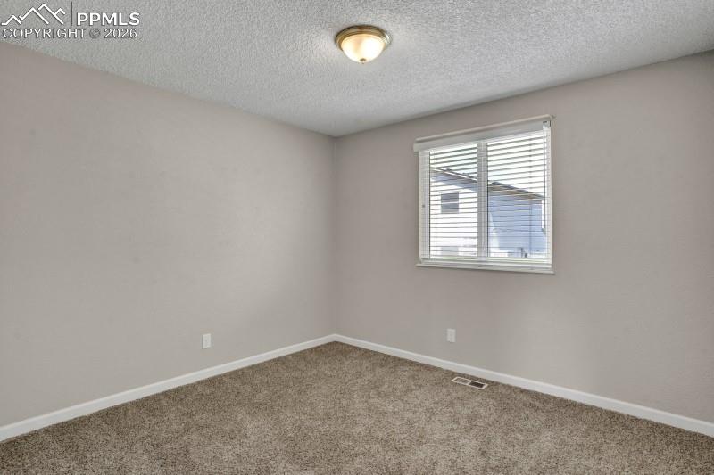 Image 19 of 26: Bedroom