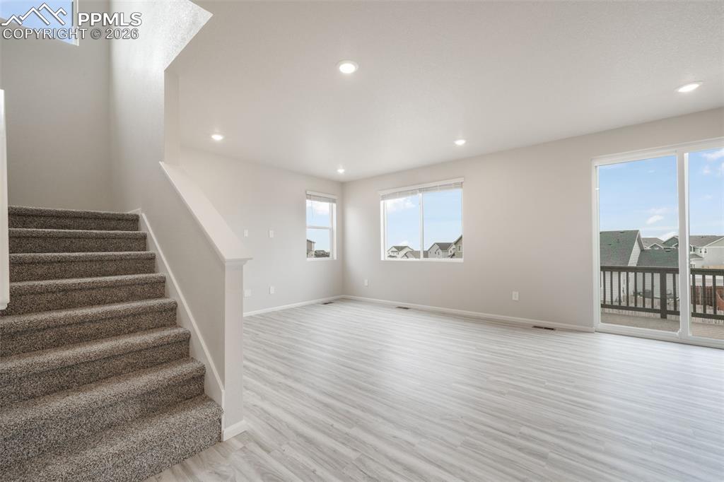 Image 12 of 50: Living room looking up stairs
