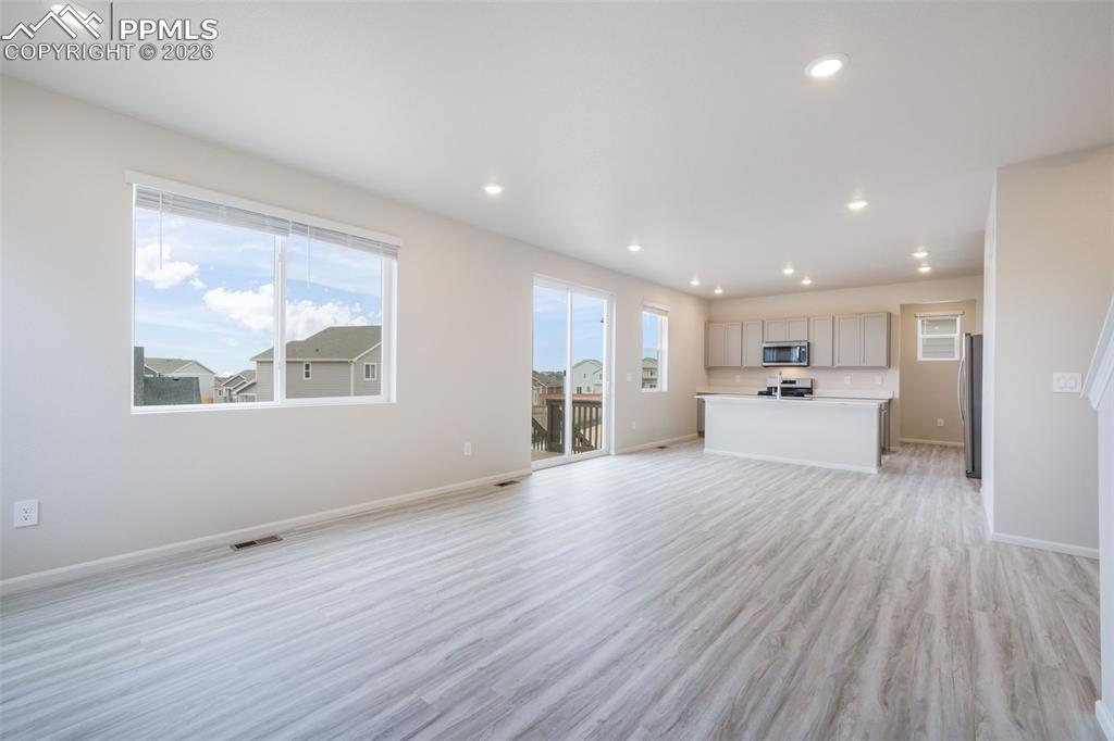 Image 13 of 50: From living room looking toward kitchen
