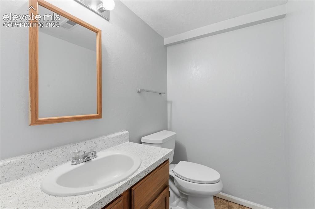 Image 14 of 31: Hall bathroom on main level.