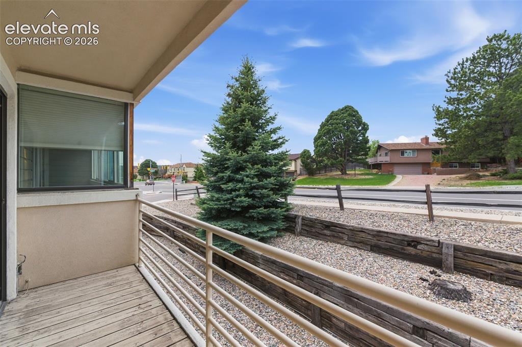 Image 19 of 31: Private balcony off primary bedroom.