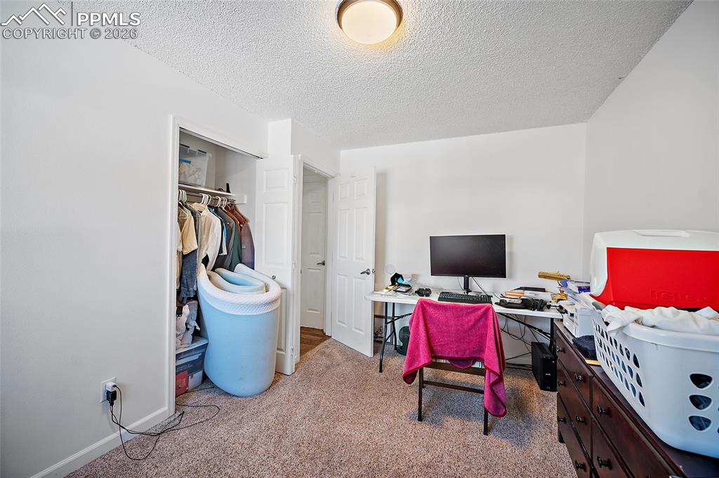 Image 22 of 37: Main level being used as an office.