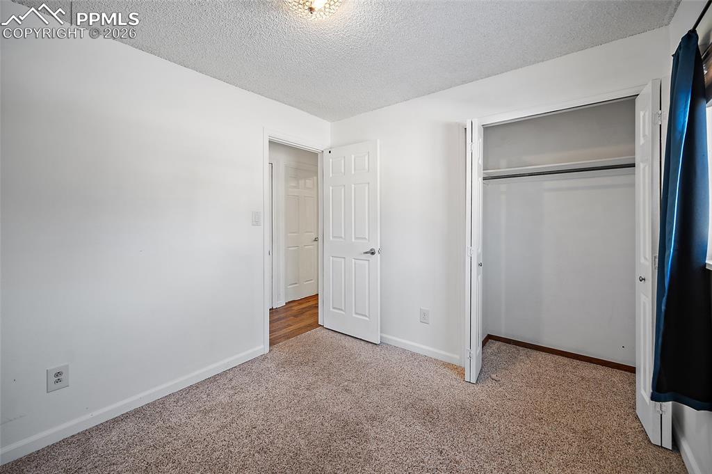 Image 25 of 37: Main level bedroom. 