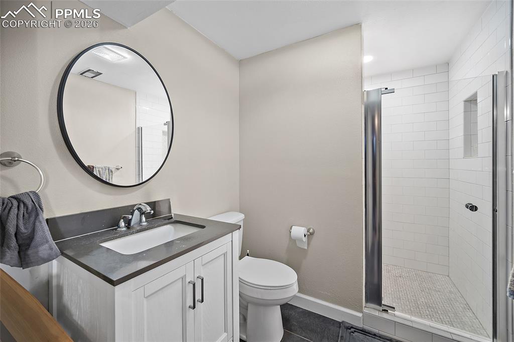 Image 38 of 42: Lower-level bath with large walk-in shower! 