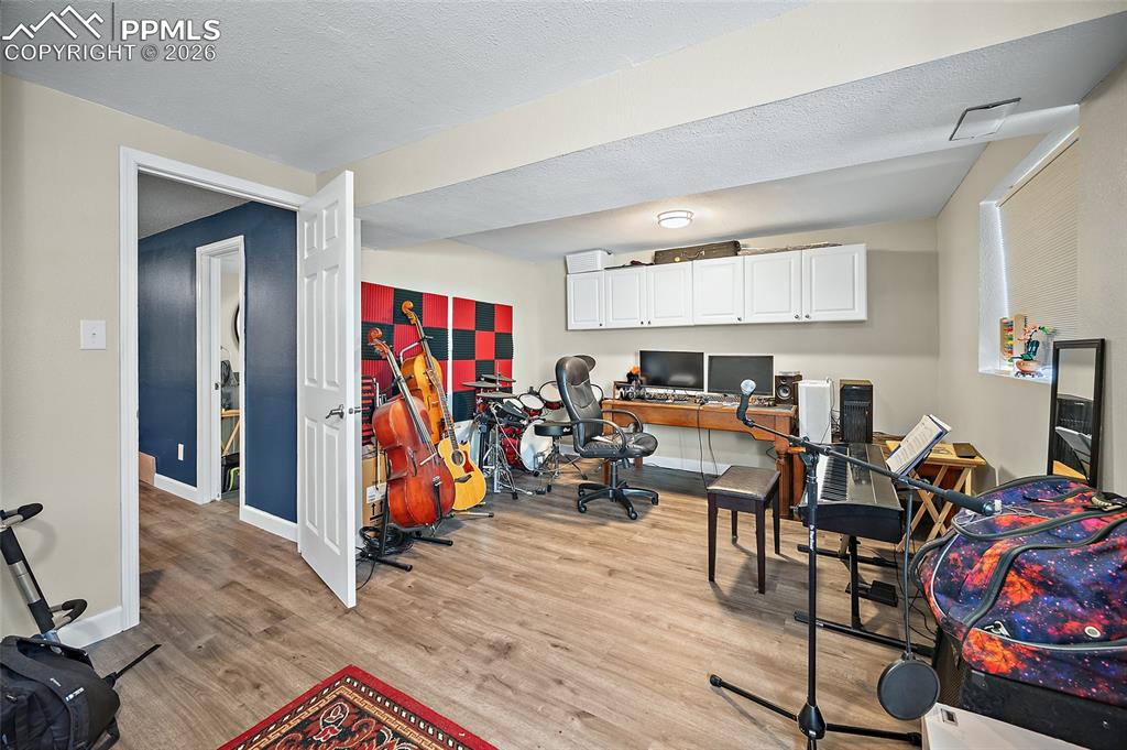 Image 39 of 42: Bedroom being used as a music room. 
