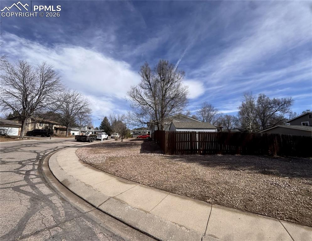 Image 40 of 42: Large corner lot with huge storage shed in the backyard.