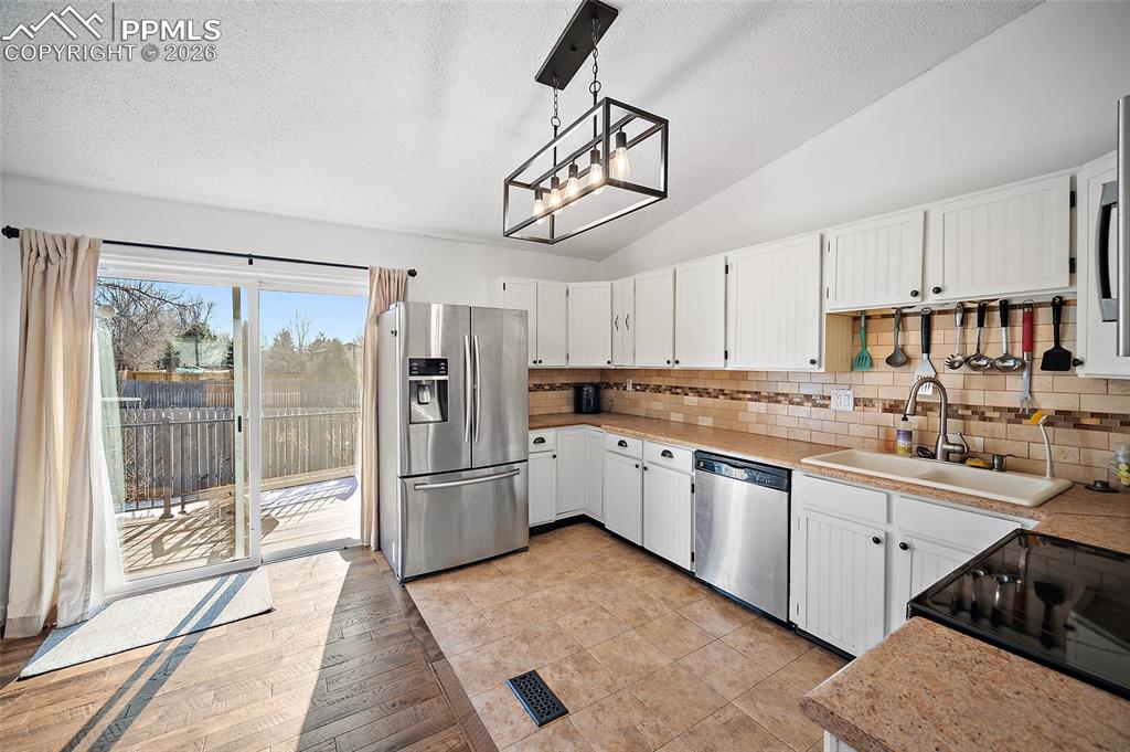 Image 5 of 37: Walk out to the deck and backyard. Great for BBQ