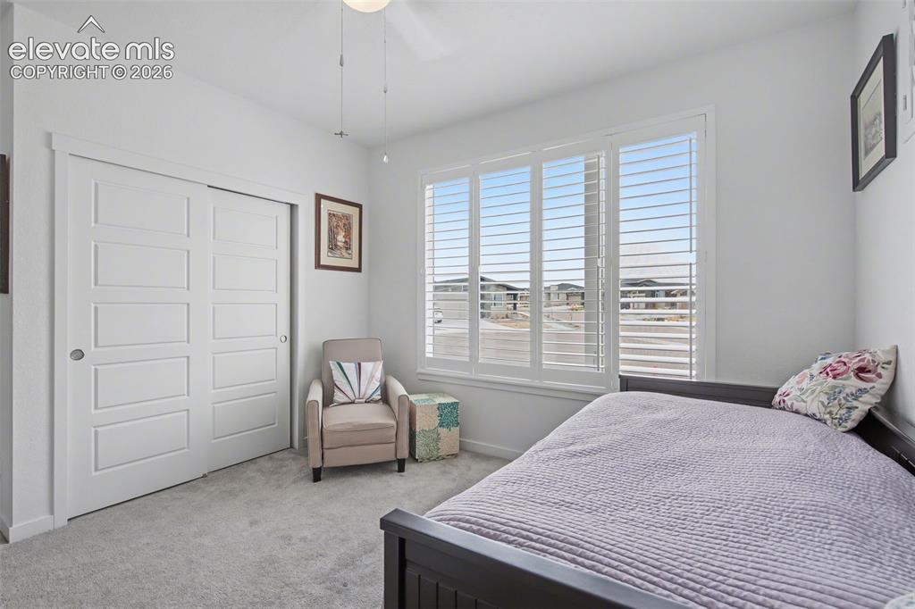 Image 21 of 41: Office featuring light colored carpet and baseboards