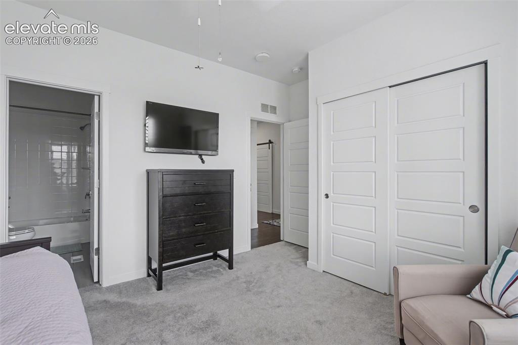 Image 22 of 41: Home office with carpet flooring and baseboards