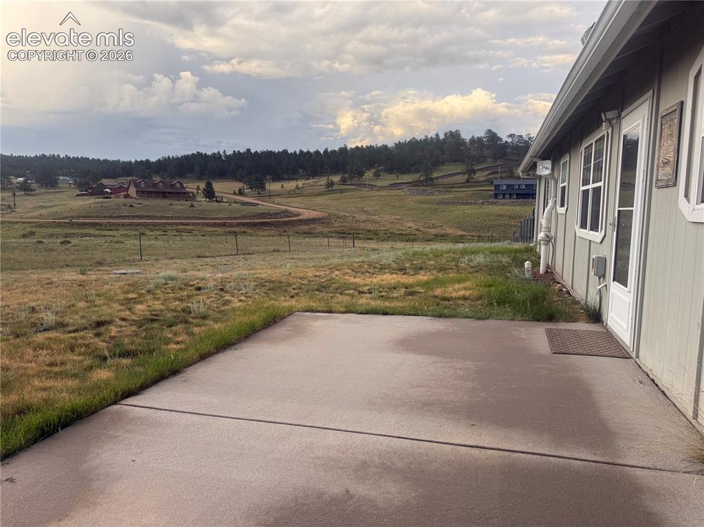 Image 10 of 30: large cement patio for grilling