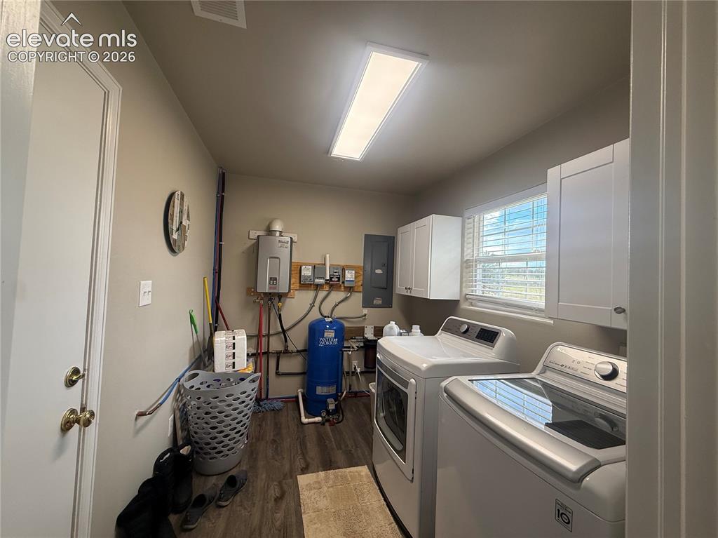 Image 29 of 30: large laundry off kitchen and garage mud room