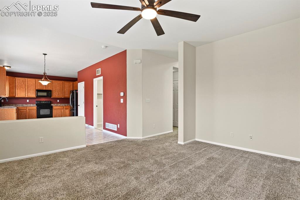 Image 10 of 32: Family Room looking into Kitchen