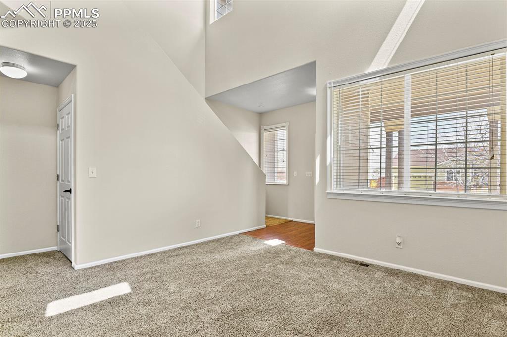 Image 5 of 32: Looking toward front door with walk in coat closet