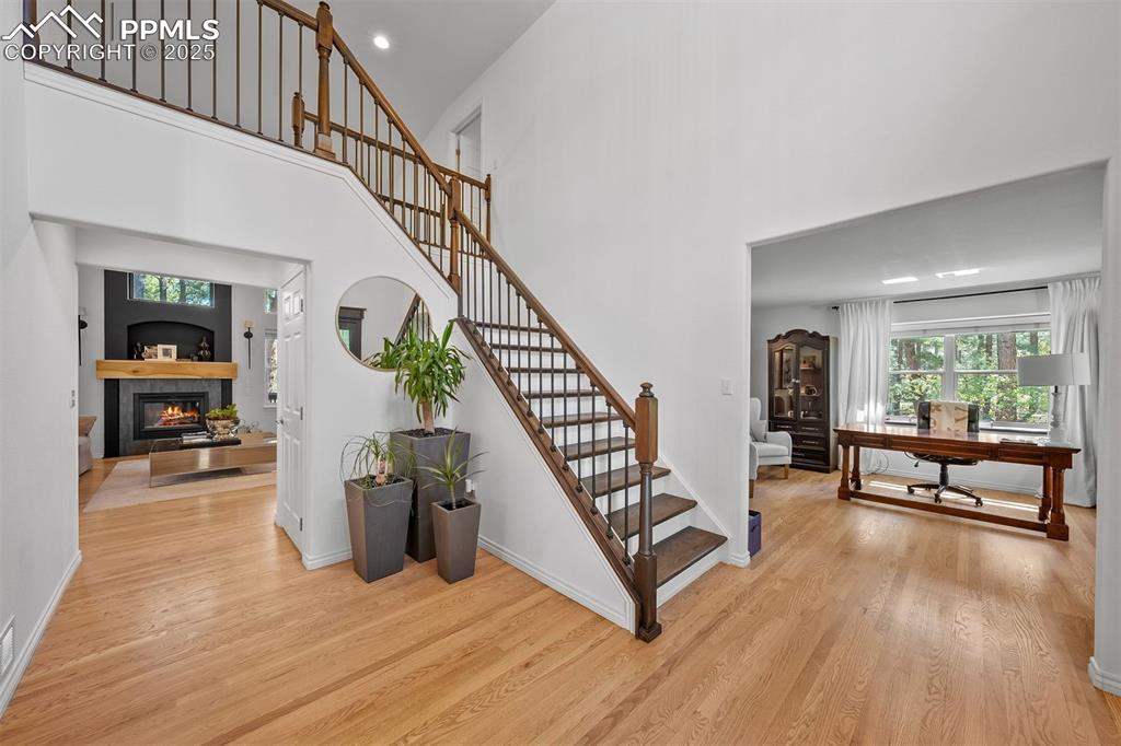Image 10 of 30: 17-foot foyer open to two-story ceiling and upper level welcomes you into t