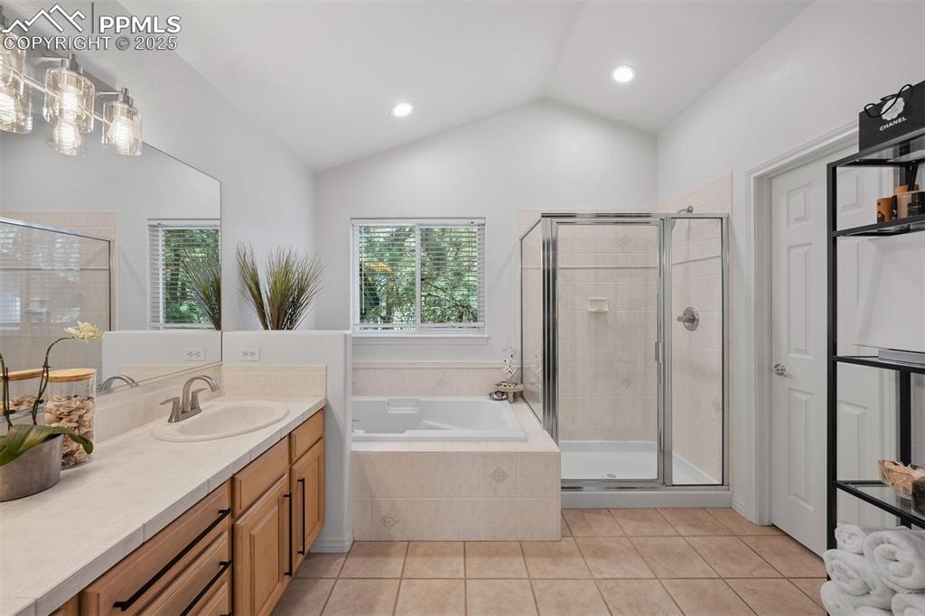 Image 12 of 30: Five piece primary bathroom includes water closet for privacy.