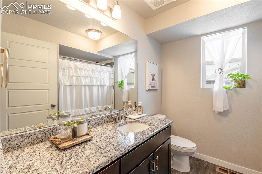 Image 19 of 29: Hall bathroom with shower/tub combo 