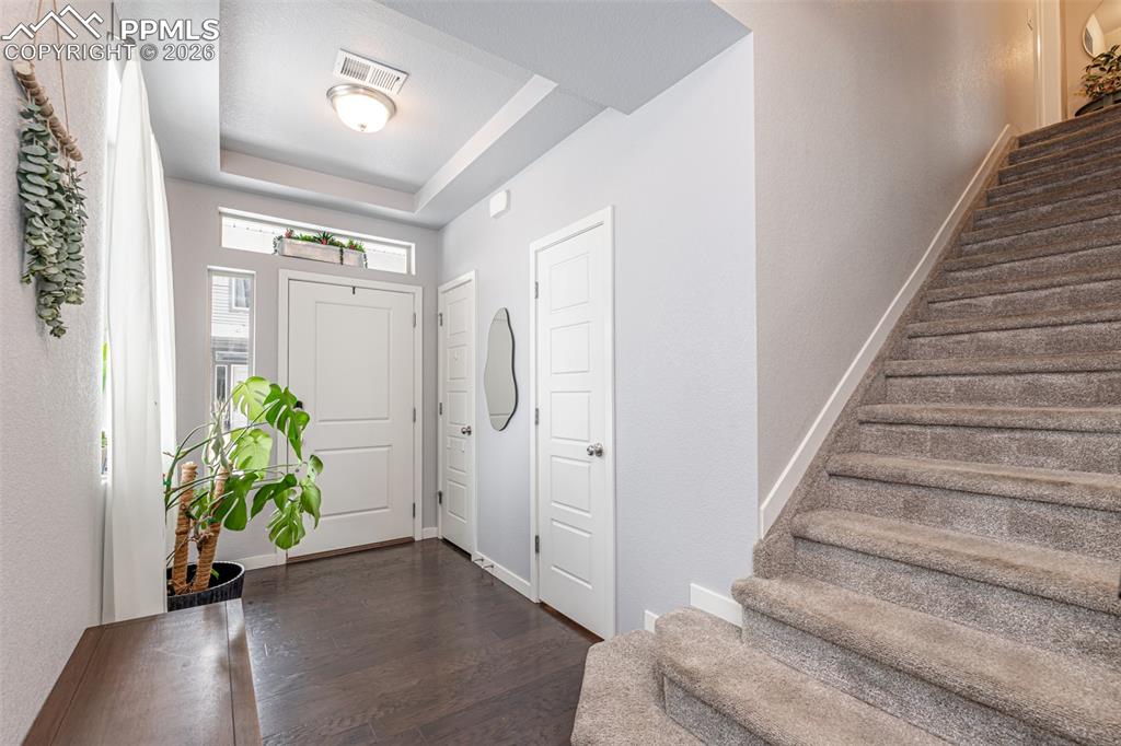 Image 5 of 29: Welcome Home!  Half bath and coat closet with access to crawl space. 