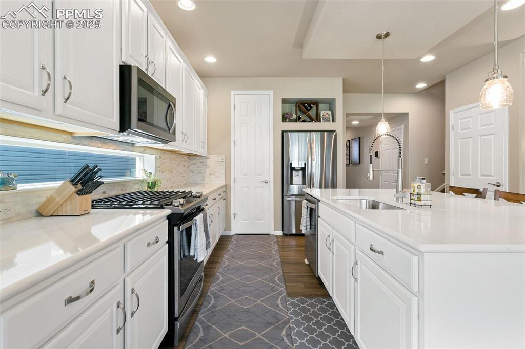 Image 10 of 35: This kitchen features all the upgrades- quartz countertops, spacious island