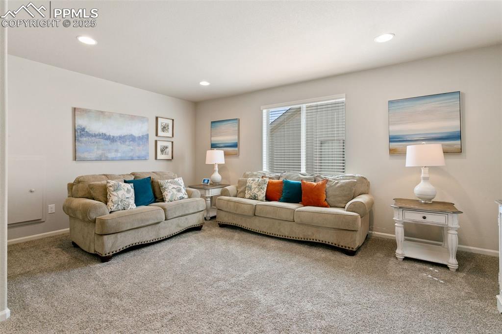 Image 22 of 35: The loft space allows flexibility for a family room, home gym, and more!