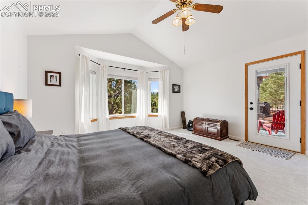 Image 24 of 50: Primary Bedroom with entrance to back patio