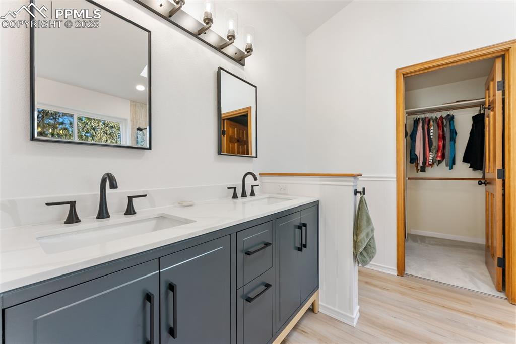 Image 25 of 50: Primary bathroom and walkin closet